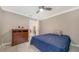 Charming bedroom with a dresser and a comfortable bed at 134 Da Vinci Dr, Nokomis, FL 34275