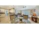 Bright kitchen with white cabinets, granite counters, and tile flooring at 134 Da Vinci Dr, Nokomis, FL 34275