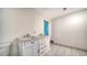 Bathroom with double vanity and tiled floor at 134 Da Vinci Dr, Nokomis, FL 34275