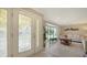 Entryway with decorative glass door and view into the living room at 134 Da Vinci Dr, Nokomis, FL 34275