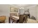 Formal dining room with wood table and seating for six at 134 Da Vinci Dr, Nokomis, FL 34275