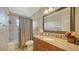 Clean bathroom with granite vanity and tile shower/tub at 134 Da Vinci Dr, Nokomis, FL 34275