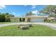 Single-story home with a large yard and attached garage at 134 Da Vinci Dr, Nokomis, FL 34275
