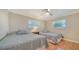 Bedroom featuring two twin beds and a ceiling fan at 134 Da Vinci Dr, Nokomis, FL 34275