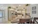 Eat-in kitchen with breakfast bar and stainless steel appliances at 134 Da Vinci Dr, Nokomis, FL 34275