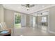 Bedroom with sliding glass doors and mirrored closet at 134 Da Vinci Dr, Nokomis, FL 34275