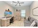 Home office with desk, comfortable seating, and built-in shelving at 14132 Campfire Ct, Parrish, FL 34219