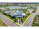 Aerial view of community with pool, clubhouse, and lake at 14132 Campfire Ct, Parrish, FL 34219