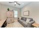 Home office with desk, comfortable seating, and built-in shelving at 14132 Campfire Ct, Parrish, FL 34219