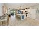 Open concept kitchen with large island and stainless steel appliances at 14132 Campfire Ct, Parrish, FL 34219