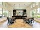 Open concept community kitchen with a stunning blue tile backsplash and ample counter space at 14132 Campfire Ct, Parrish, FL 34219