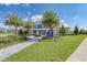 Community clubhouse with landscaping and signage at 14132 Campfire Ct, Parrish, FL 34219