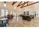 Elegant community room boasting exposed beams, a tiled floor, and comfortable furnishings at 14132 Campfire Ct, Parrish, FL 34219