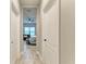 Bright hallway with tile flooring and access to bedrooms at 14132 Campfire Ct, Parrish, FL 34219