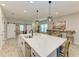 Spacious kitchen with island, stainless steel appliances, and white cabinets at 14132 Campfire Ct, Parrish, FL 34219