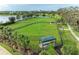 Community dog park with fenced area, shaded seating, and water stations at 14132 Campfire Ct, Parrish, FL 34219