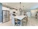 Open concept kitchen with large island and stainless steel appliances at 14132 Campfire Ct, Parrish, FL 34219
