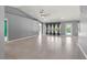 Spacious living room with tile floor and access to pool at 1661 Atwater Dr, North Port, FL 34288