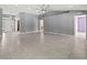 Large living room with tile floors and ceiling fan at 1661 Atwater Dr, North Port, FL 34288
