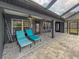 Spacious pool patio with lounge chairs, offering ample relaxation space at 1661 Atwater Dr, North Port, FL 34288