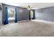 Spacious main bedroom with pool view and ceiling fan at 1661 Atwater Dr, North Port, FL 34288