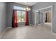 Bright dining room with tile floors and red curtains at 1661 Atwater Dr, North Port, FL 34288