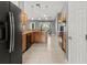Bright kitchen with wood cabinets, stainless steel appliances, and tile flooring at 1661 Atwater Dr, North Port, FL 34288