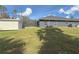 Landscaped backyard with shed and pool at 1661 Atwater Dr, North Port, FL 34288
