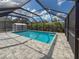 Enjoy the screened-in pool and spacious patio area at 1661 Atwater Dr, North Port, FL 34288