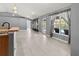 Bright living room with tile flooring, high ceilings, and pool view at 1661 Atwater Dr, North Port, FL 34288