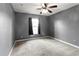 Spacious bedroom with window and ceiling fan at 1661 Atwater Dr, North Port, FL 34288