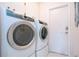 Laundry room with side-by-side washer and dryer at 2121 Tanglewood Dr, Sarasota, FL 34239