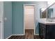 Bathroom with dark vanity, and a walk-in closet at 2415 Ancient Rd, North Port, FL 34286