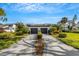 Front view of two-story townhome with attached two-car garage and manicured landscaping at 3119 Heatherwood Ln, Sarasota, FL 34235