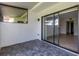 Private screened patio with sliding glass doors to interior at 3119 Heatherwood Ln, Sarasota, FL 34235