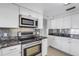 Modern kitchen with stainless steel appliances and granite countertops at 3119 Heatherwood Ln, Sarasota, FL 34235