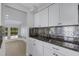 Modern kitchen with granite countertops and stainless steel appliances at 3119 Heatherwood Ln, Sarasota, FL 34235