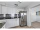 Modern kitchen with stainless steel appliances and granite countertops at 3119 Heatherwood Ln, Sarasota, FL 34235