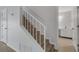 Staircase with tile flooring and white railing at 3119 Heatherwood Ln, Sarasota, FL 34235