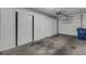 Garage with ample storage and overhead door at 3119 Heatherwood Ln, Sarasota, FL 34235
