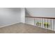 Spacious loft area with tile flooring and a view at 3119 Heatherwood Ln, Sarasota, FL 34235