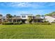 Modern two-story home with lush landscaping and golf course view at 3119 Heatherwood Ln, Sarasota, FL 34235