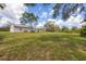 Ranch style home with metal roof and large yard at 38603 Taylor Rd, Myakka City, FL 34251