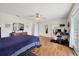 Large main bedroom with hardwood floors, ceiling fan, and ensuite bath at 38603 Taylor Rd, Myakka City, FL 34251