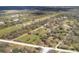 Expansive aerial view of a vast property with a charming home, surrounded by lush greenery and natural beauty at 38603 Taylor Rd, Myakka City, FL 34251