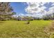 Single story home with metal roof and large yard at 38603 Taylor Rd, Myakka City, FL 34251