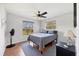 Comfortable bedroom with natural light, wood floors, and ceiling fan at 38603 Taylor Rd, Myakka City, FL 34251