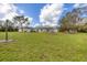 Single story home with metal roof and large yard at 38603 Taylor Rd, Myakka City, FL 34251