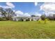 Single-story home with a metal roof and a spacious lawn at 38603 Taylor Rd, Myakka City, FL 34251
