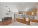 Bright kitchen with wood cabinets, island, and stainless steel appliances at 38603 Taylor Rd, Myakka City, FL 34251